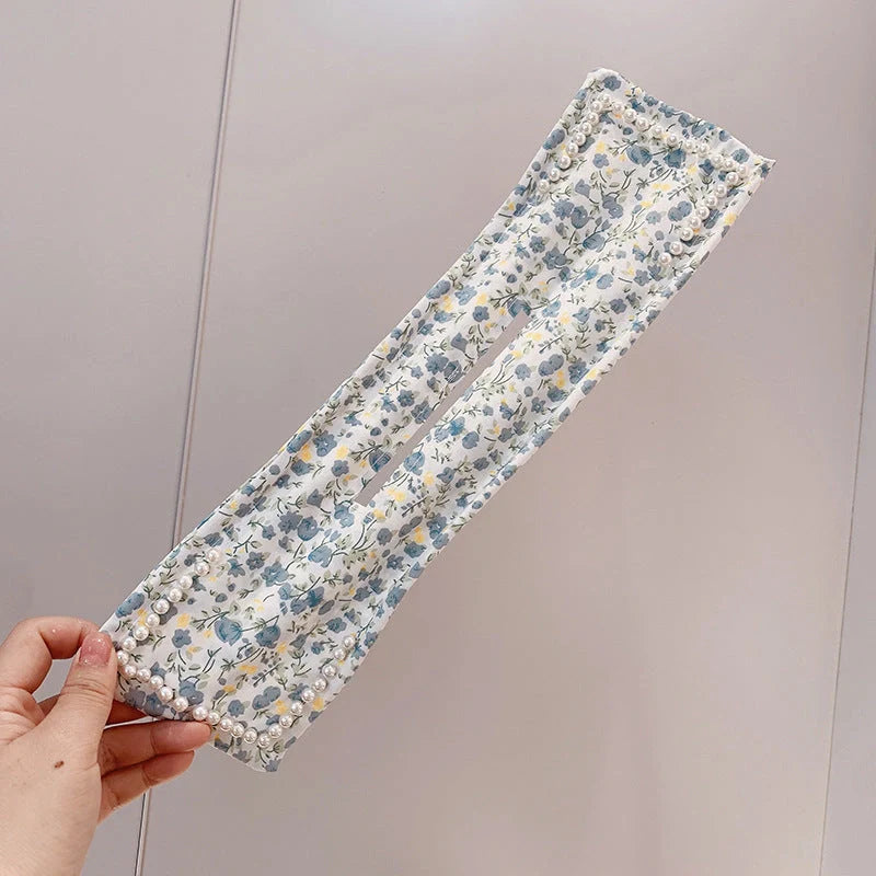 Women's elegant cloth headband with diamond or pearl accents for stylish hairstyles