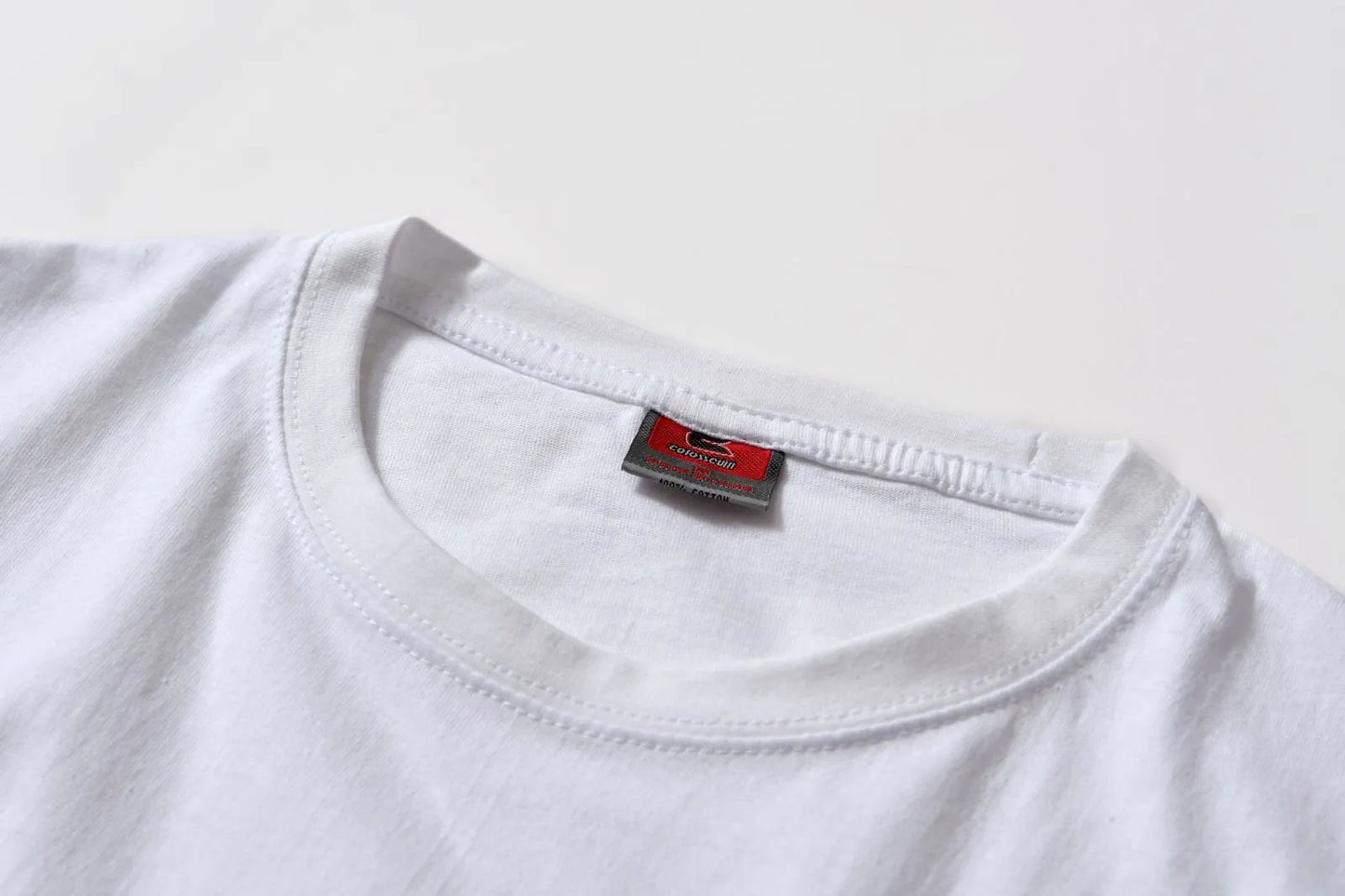 White cotton T-shirt style overalls with short sleeves and loose fit pullover design