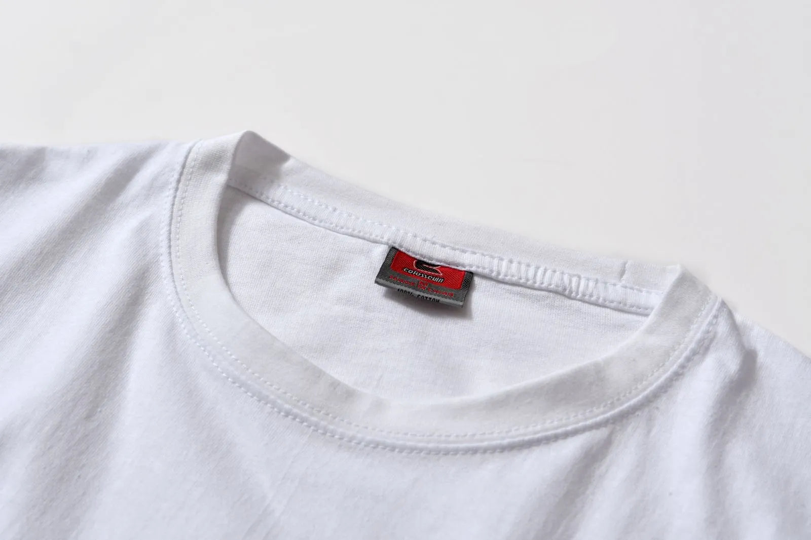 White cotton T-shirt style overalls with short sleeves and loose fit pullover design