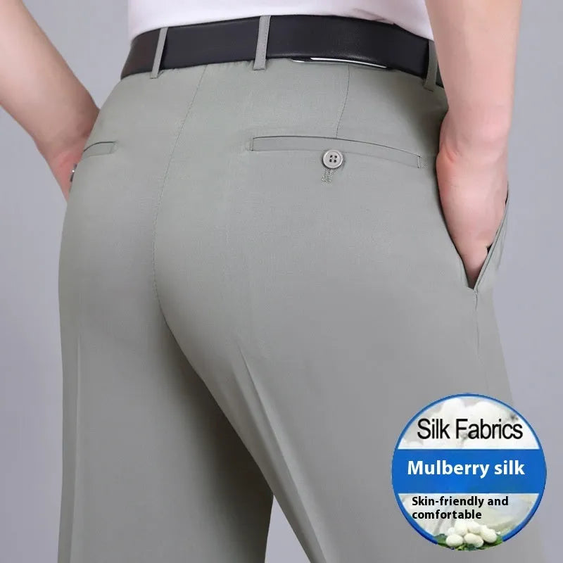 Man wearing dark blue straight-leg non-iron business trousers with a mulberry silk blend fabric.