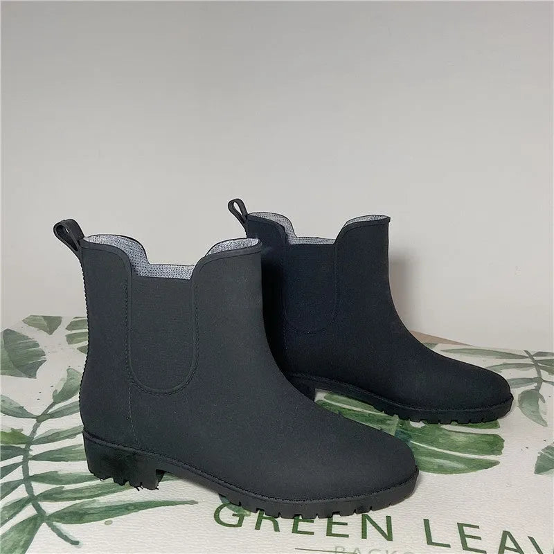 Pair of short casual PVC rain boots with non-slip sole and 3-5cm mid heel, shown in pink, milky white, and black