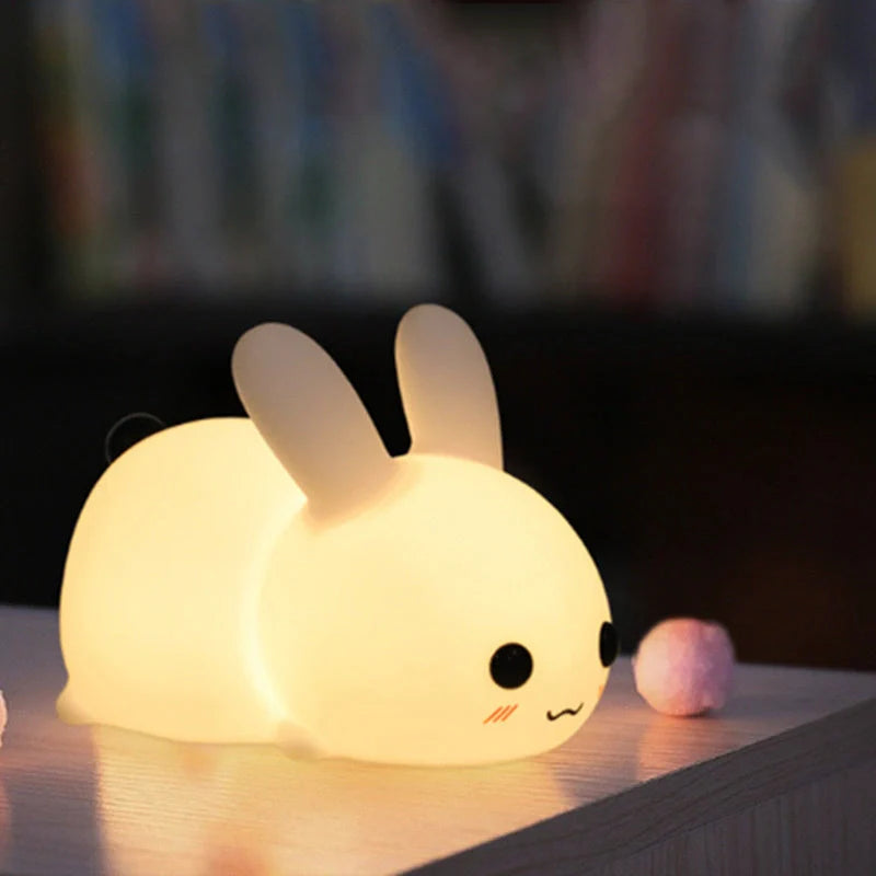 Rabbit-shaped silicone nightlight with warm amber and cool white dual colour illumination, perfect for bedside or home decor
