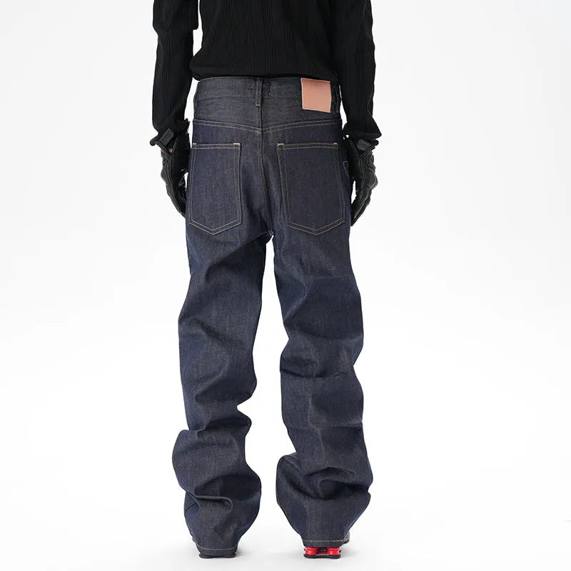 Men's dark blue loose straight-leg denim jeans laid flat, showing front view.