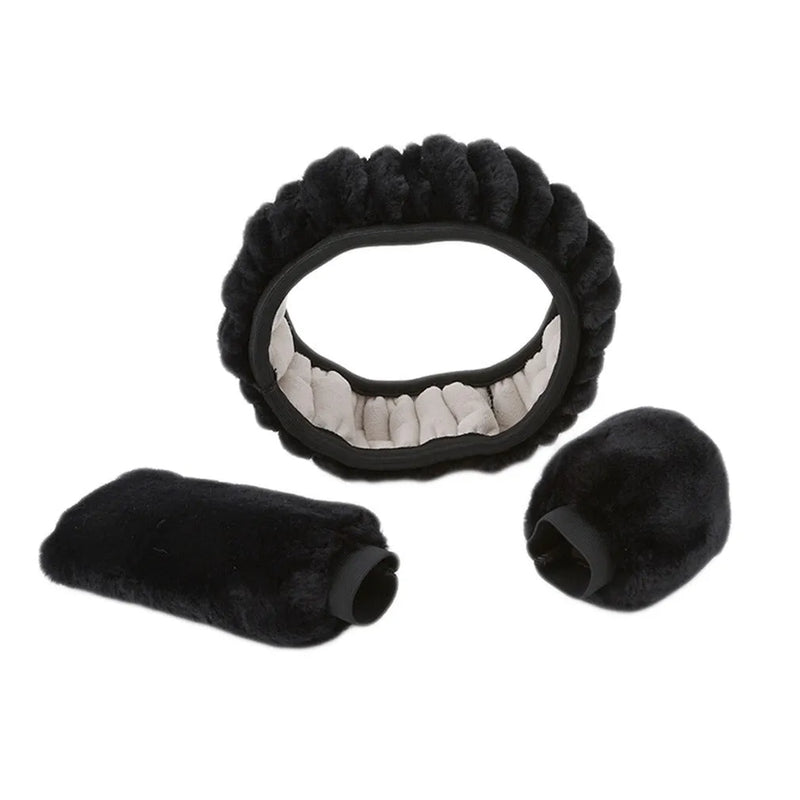 Winter steering wheel cover set includes plush wheel cover, gear shift knob cover, and handle sleeve to insulate cold car interiors during winter months, available in six colours including black, pink, beige, white, brown and purple