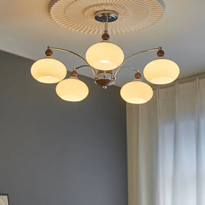 Persimmon glass chandelier with chrome frame in Middle Ancient style, shown with multiple glass shades.