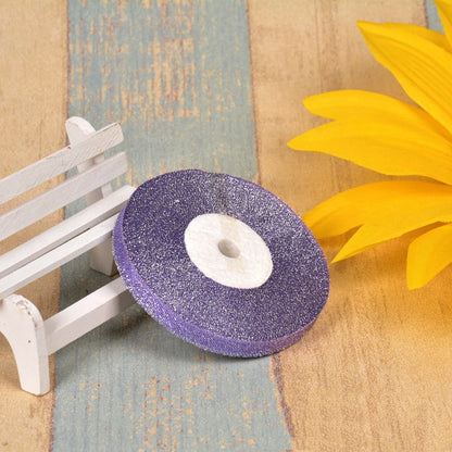 Close-up of green onion patterned ribbon with gold wire on a 25-yard roll, showing 3-points width.