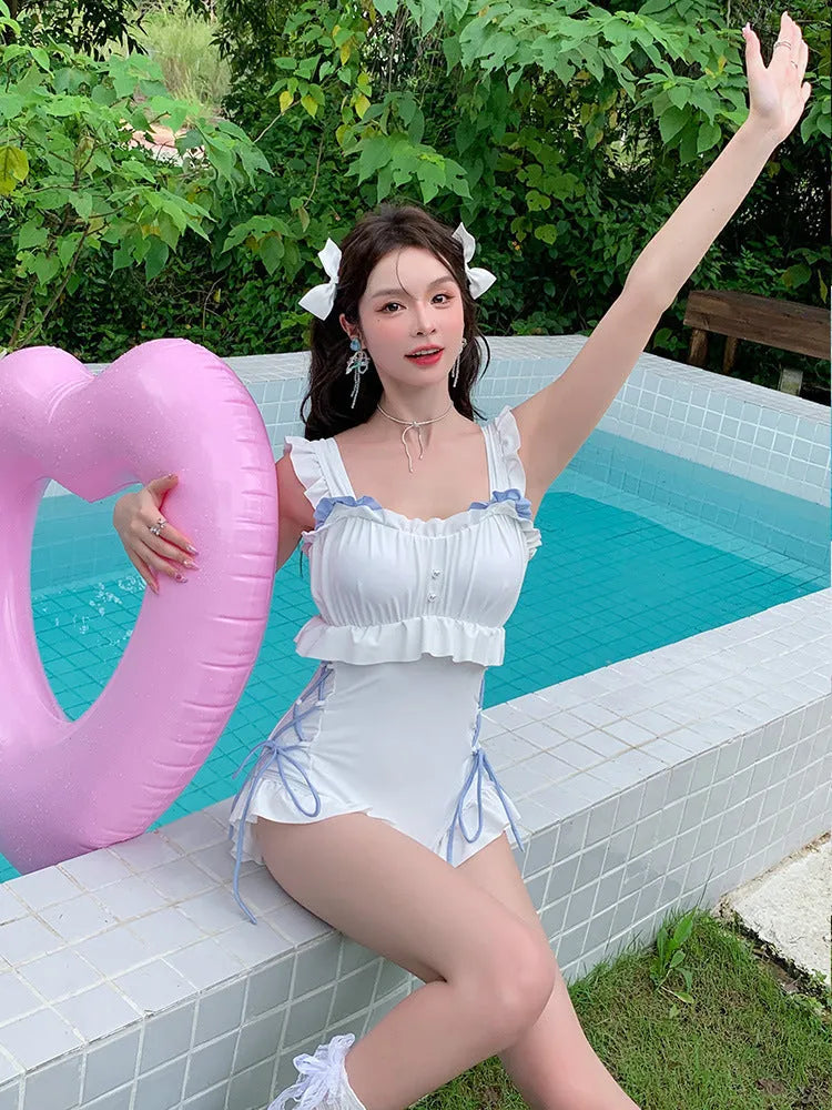 Women's solid colour Milky White backless one-piece swimsuit on hanger
