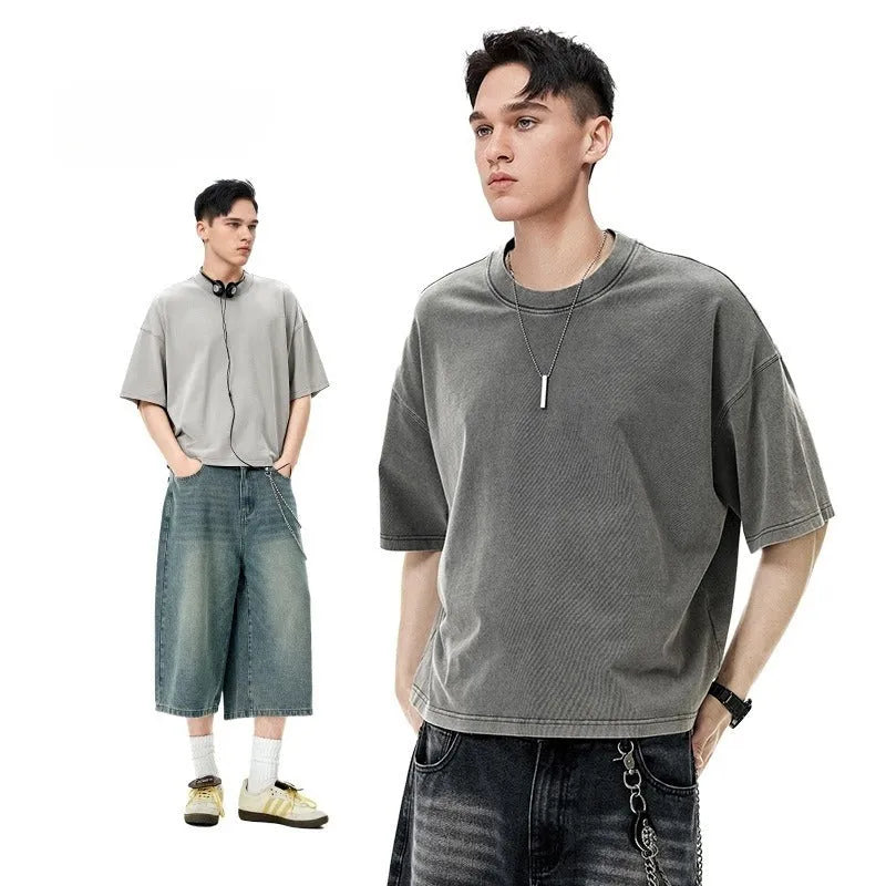 Men's vintage t-shirt in soft cotton with loose fit and washed-out finish, long-sleeved casual top with drop-shoulder sleeves and pullover style, available in khaki light colour, dark grey, and black in sizes M, L, and XL.