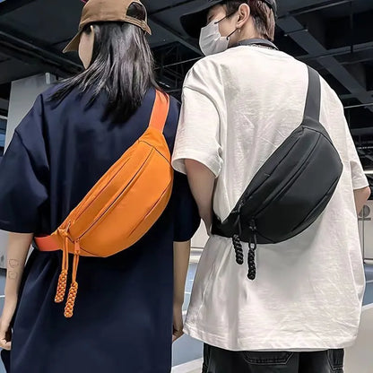Men's small black polyester crossbody chest bag with adjustable strap.