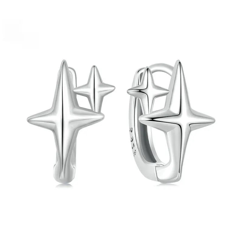 Sterling silver minimalist star ear clip with oxidised finish and XINGX design detail.