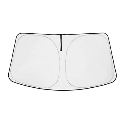 Silver tape sunshade cover fitted on a Toyota NOAH XOVY 90 series front windshield.