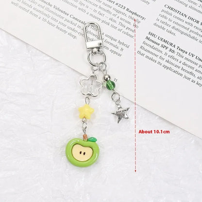 Plastic and resin fruit charm keychain with apple, strawberry designs on silver rope