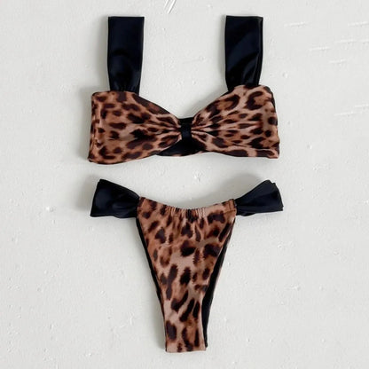 Women's black and leopard print bikini set with tube top and T-pants briefs on a mannequin.