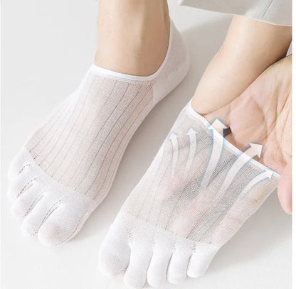 Pair of solid colour modal five-finger invisible socks on a wooden surface, showing toe separation and low-cut design.