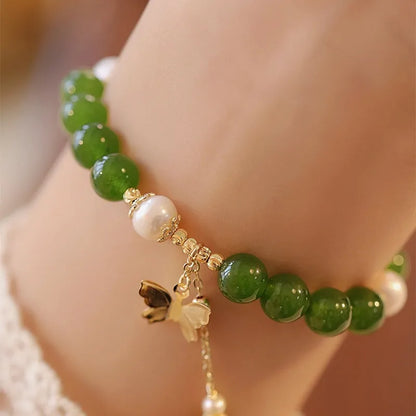 Natural green chalcedony stone bracelet with round beads in geometric arrangement
