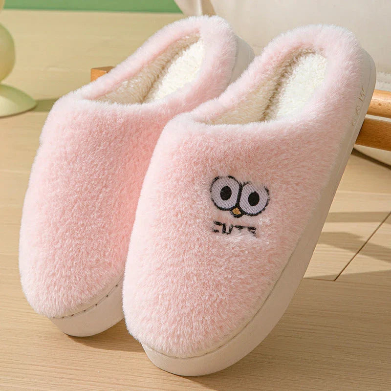 Stylish and cozy cartoon-inspired slippers with plush material and non-slip rubber soles, perfect for keeping feet warm and comfortable at home.