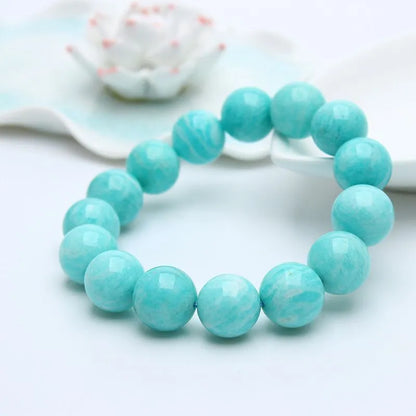 Amazonite gemstone bracelet with green-blue beads on a wrist
