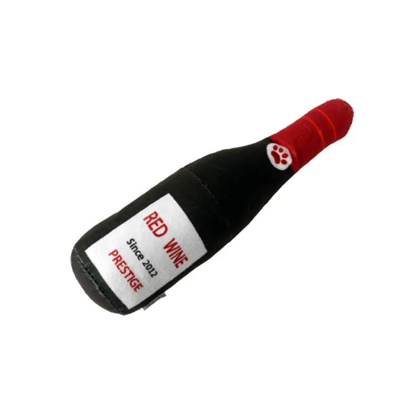 Soft green plush wine bottle pet toy for cats and dogs on a white background.