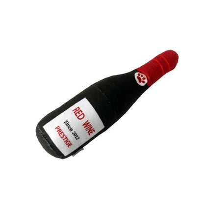 Soft green plush wine bottle pet toy for cats and dogs on a white background.