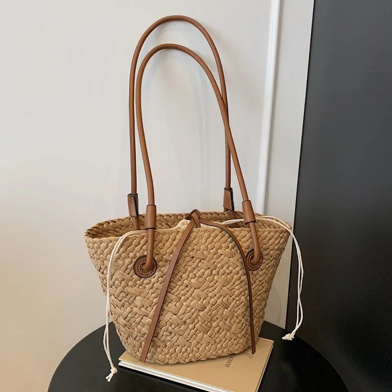 Woven shoulder bag dual-use hand-carrying large capacity retro European American style horizontal square woven bag in milky white or khaki beige available in large or small size medium soft hardness strapless design
