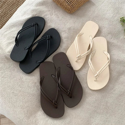 Men's PVC toe-covering flip-flop slippers on a white background, showing the injection moulded sole and available colour options.