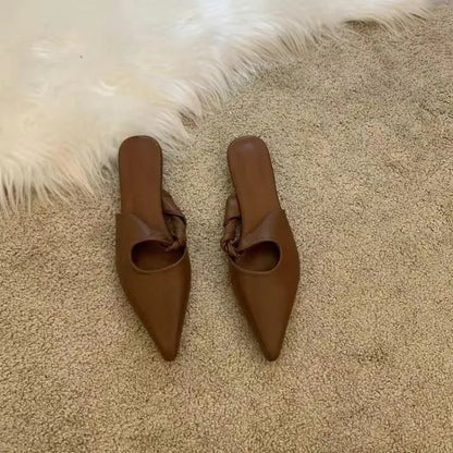 Women's soft leather-lined semi-toe box slippers in neutral colours on a rubber sole.
