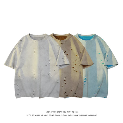 Men's grey distressed rip short sleeve t-shirt with loose fit cotton blend fabric