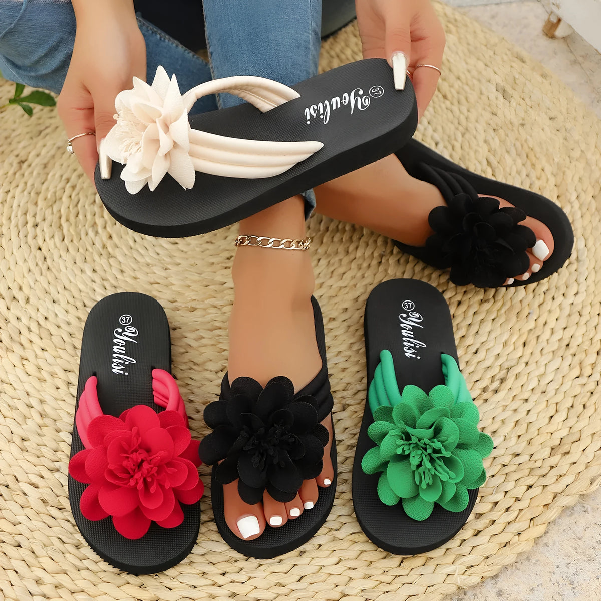 Solid-colour flower flip flops with a decorative floral detail on a viscose upper and EVA sole.