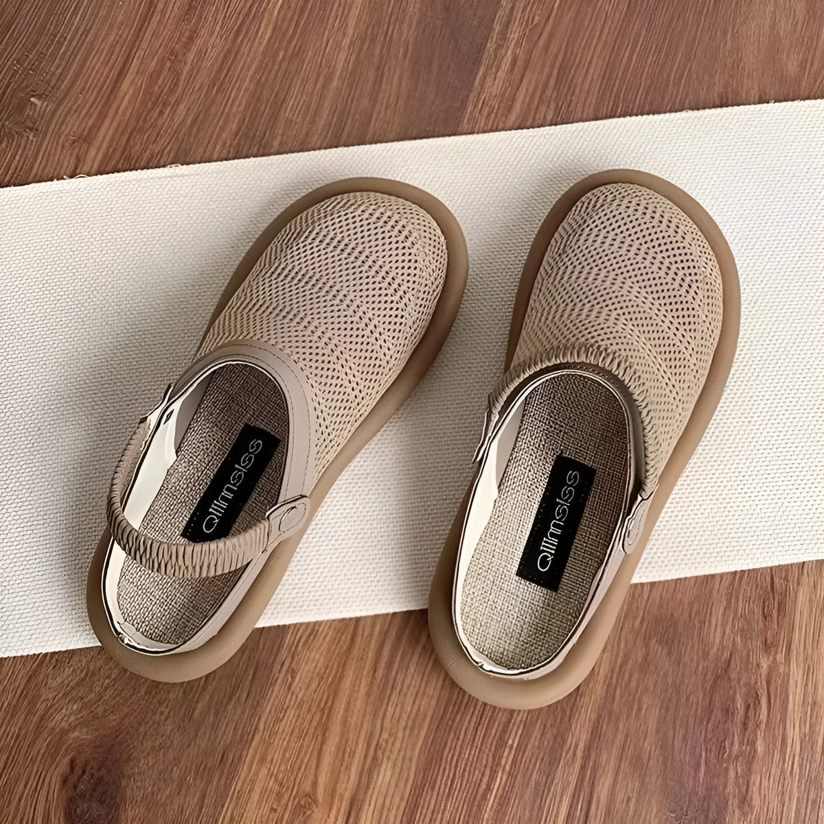 Breathable linen slip-on hole shoes in milky white colour with mesh lining and rubber sole.