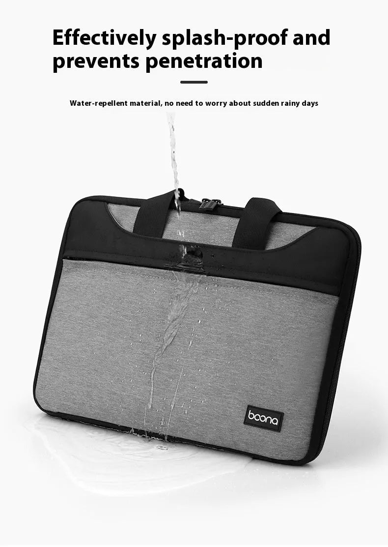 Black Oxford cloth laptop bag fully opened showing main compartment, with soft carry handle.