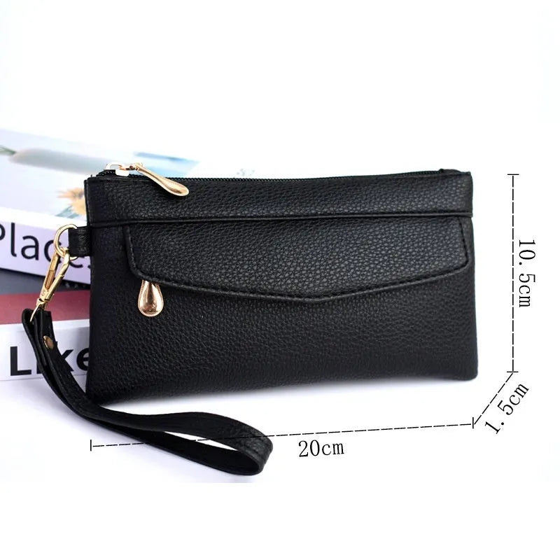 Soft surface square PU crossbody bag and clutch with internal zipper pocket in various colours.