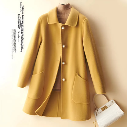 Women's double-faced wool mid-length coat with a doll collar and pearl buckle detail in a solid colour.