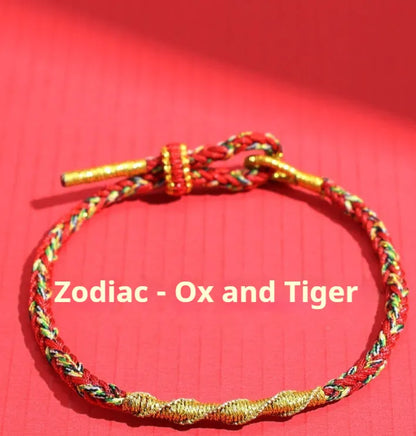 Woven eight-strand hand strap in zodiac-themed colours with flexible wire construction