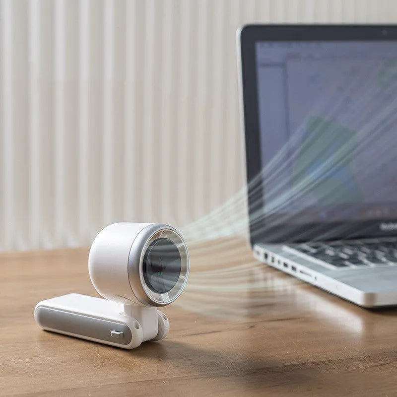 Portable folding mini fan showing adjustable head and compact plastic housing with USB Type-C charging port