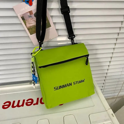 Polyester Oxford fabric messenger-style backpack in khaki colour with visible stitching and a crossbody strap.