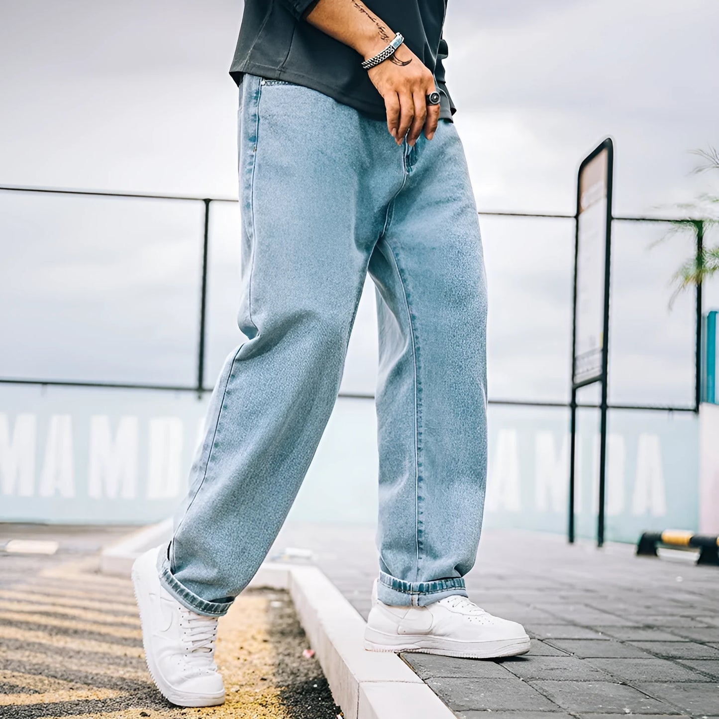 Men's loose straight jeans in dark blue colour showing relaxed fit and traditional styling