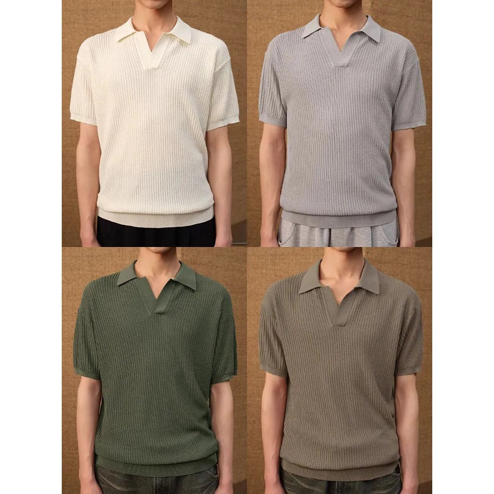 Short sleeve men's polo shirt in grey with striped collar, shown on a hanger.