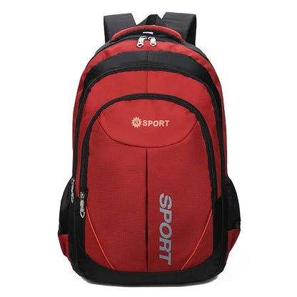 Large black nylon backpack with curved shoulder straps and letter detailing, shown from the side.