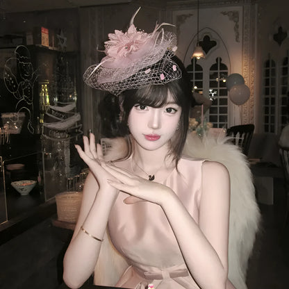 French retro feather headdress hair flower with mesh base and feather detailing in pink colour