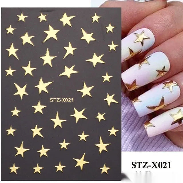 Assortment of black and silver nail sticker designs including cartoon and French tip patterns on a plastic sheet.
