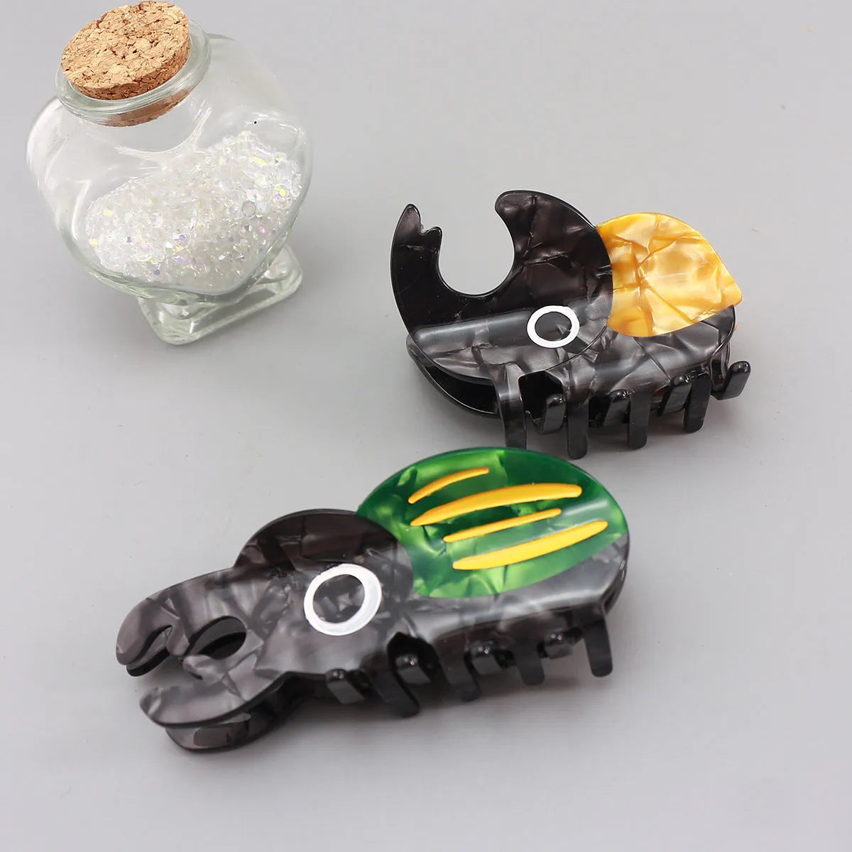 Handmade cellulose acetate beetle grip with caterpillar element in cartoon style decorative clip