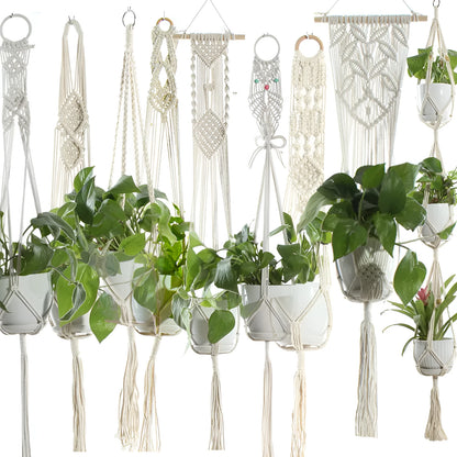 Handmade beige cotton rope net bag holding a plant pot, showing its textured sling design.