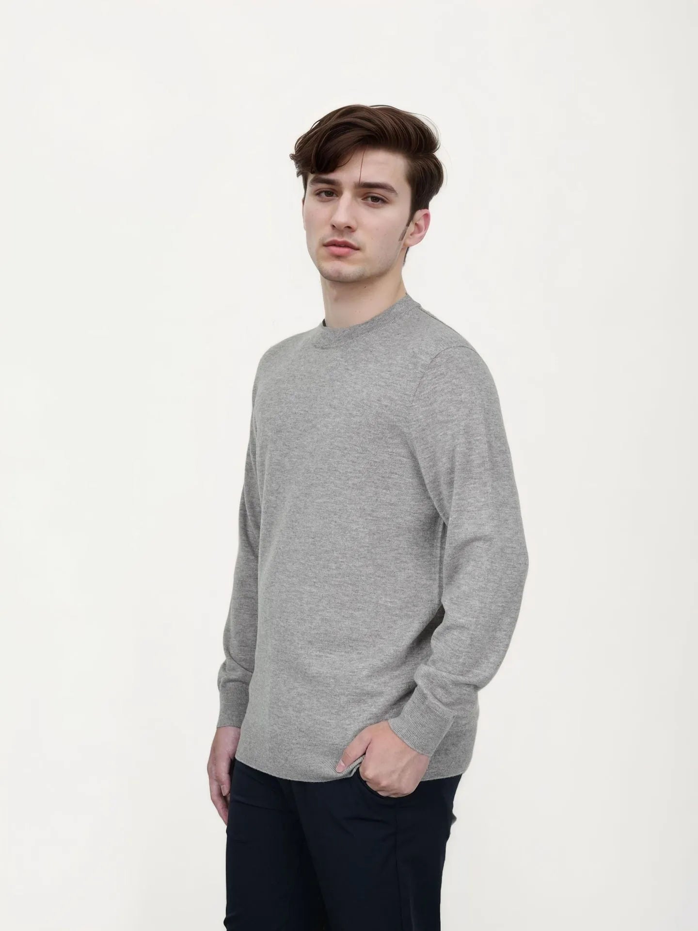 Men's V-neck wool pullover sweater in light grey shown on a model.