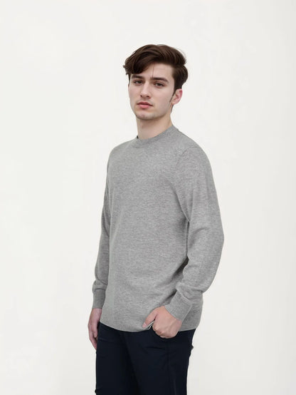 Men's V-neck wool pullover sweater in light grey shown on a model.