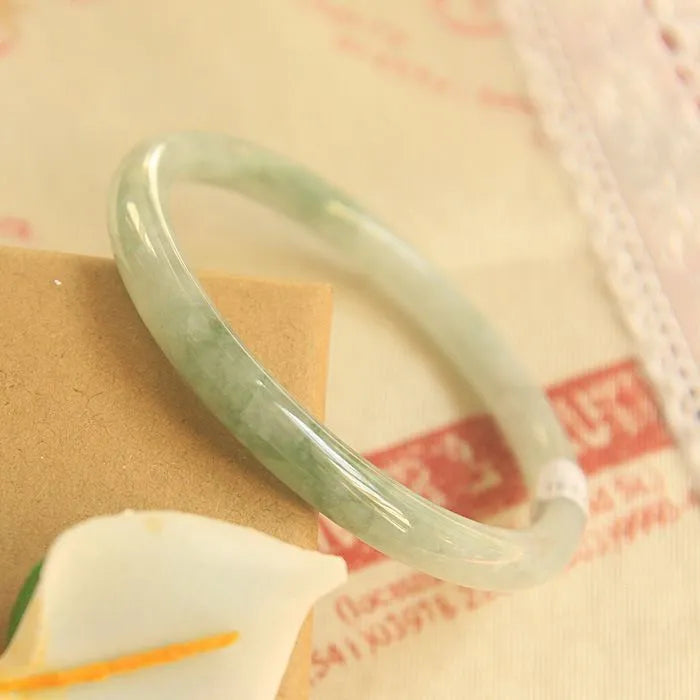 Green jade geometric bracelet with 10mm beads showing traditional Chinese style and adjustable sizing options
