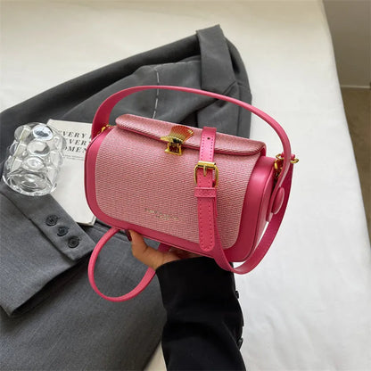 Women's PU leather messenger bag in a horizontal square shape with a lock and adjustable shoulder strap.