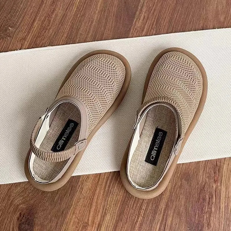 Breathable linen slip-on hole shoes in milky white colour with mesh lining and rubber sole.