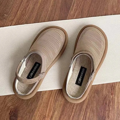 Breathable linen slip-on hole shoes in milky white colour with mesh lining and rubber sole.