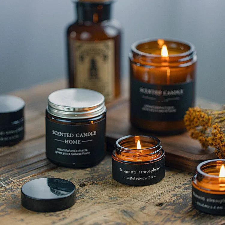 Brown glass bottle containing a hand-poured scented candle with a choice of sunny rose, lavender thyme, or bayberry fragrance.