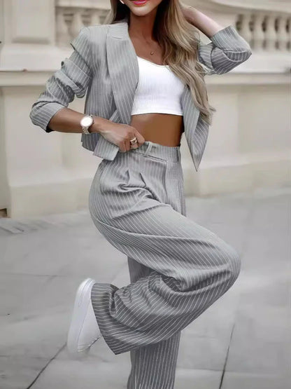 Stylish striped two-piece outfit featuring a cropped top and straight-leg pants in a variety of colors